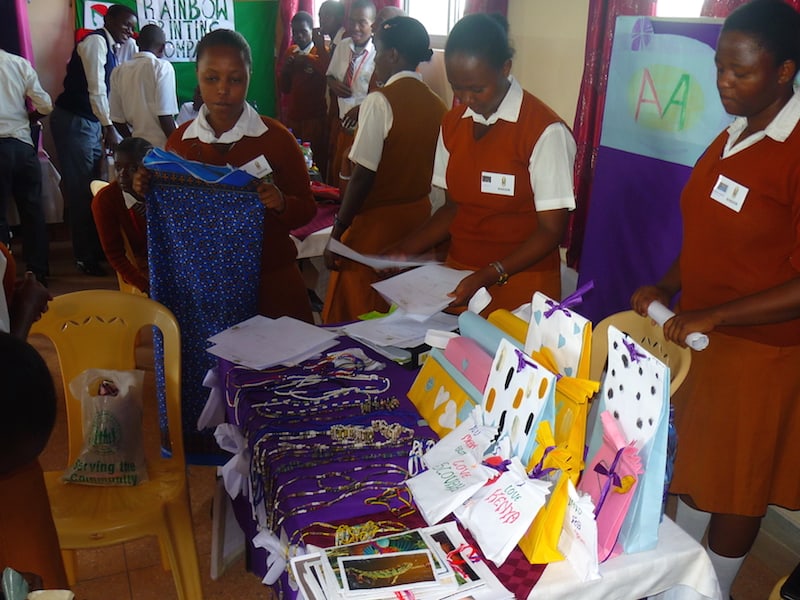 Girls from Marvelous Arts at Kajire High Image: School setting up their stall