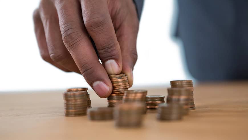 Hand stacking coins