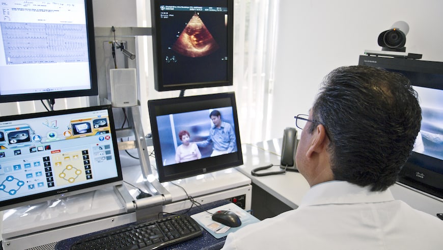 A cardiologist in Mexico has a pre-op consultation via video with a patient and her doctor who are 400 miles away in California.