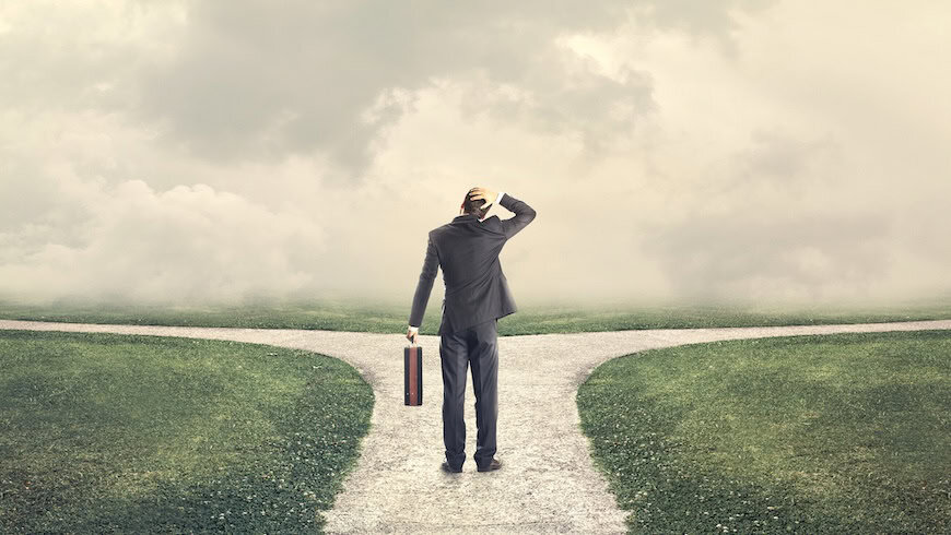 Businessman at crossroads