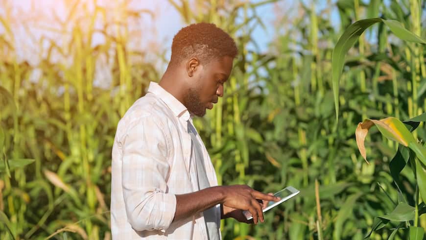 Man gathering monitoring data on farm
