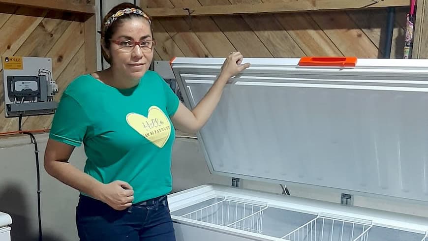 Woman with solar freezer
