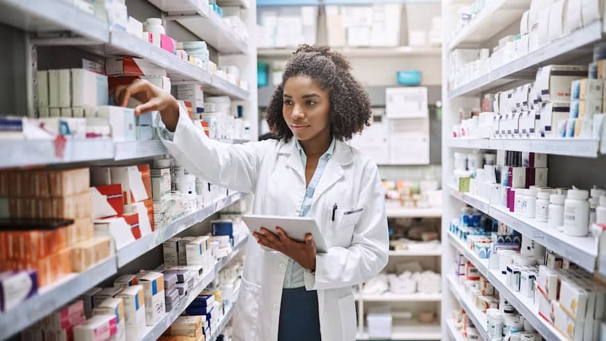 Woman restocking pharmacy in Africa