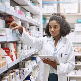 Woman restocking pharmacy in Africa