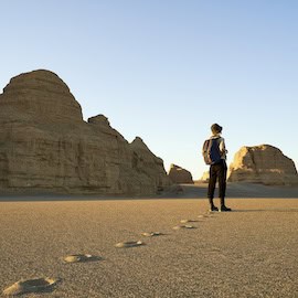 Hiker in desert valley