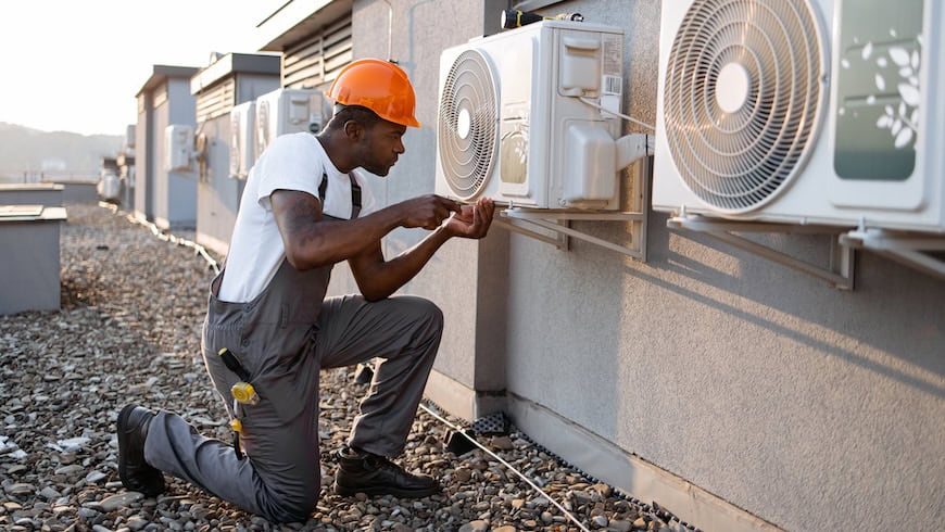 Man installing air conditioner