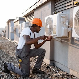 Man installing air conditioner