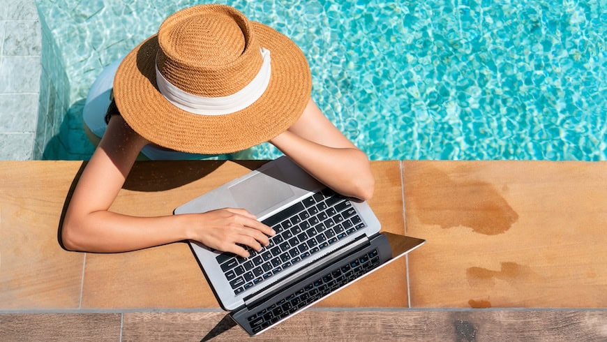 Woman working at poolside