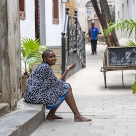 https://www.istockphoto.com/photo/african-girl-rest-on-the-street-in-stone-town-on-the-island-of-zanzibar-tanzania-gm1219066584-356459807