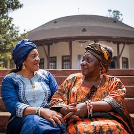 https://www.istockphoto.com/photo/two-african-women-are-conversing-sitting-on-the-stairs-they-are-both-dressed-in-gm1372934744-441922404