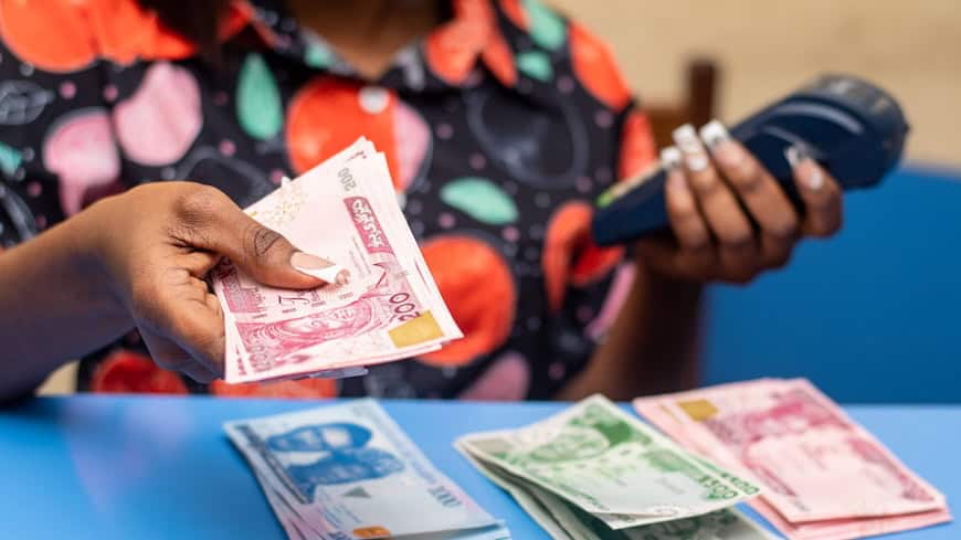 https://www.istockphoto.com/photo/african-female-holding-the-nigerian-naira-banknotes-and-pos-terminal-gm1492824435-516712570