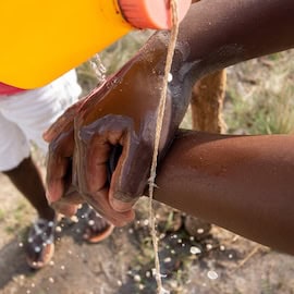 https://www.istockphoto.com/photo/hand-washing-alternative-called-tippy-tap-made-of-5-liter-water-gallon-and-a-string-gm1593868878-529654514