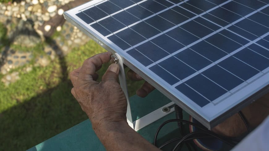 https://www.istockphoto.com/photo/a-man-mounting-a-small-50-watt-polycrystalline-solar-panel-on-the-eaves-of-a-roof-of-gm2155540024-576348955