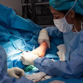 https://www.istockphoto.com/photo/female-doctor-performing-a-surgery-orthopedic-surgeon-surgery-and-insurance-concept-gm2215753765-632472087