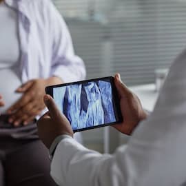 https://www.istockphoto.com/photo/pregnant-young-adult-black-woman-undergoing-ultrasound-examination-in-clinic-gm2234498039-649924491