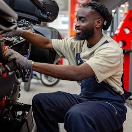 https://www.istockphoto.com/photo/man-is-working-on-a-custom-made-motorbike-gm2254139796-667471182