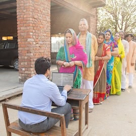 https://www.istockphoto.com/photo/rural-indian-people-standing-in-a-queue-to-get-their-documents-verified-to-get-gm2256022693-669212071