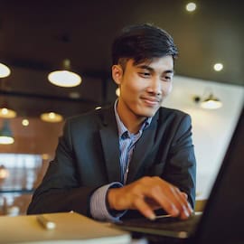 https://www.istockphoto.com/photo/smiling-asian-businessman-in-suit-working-with-laptop-gm845530100-138398903
